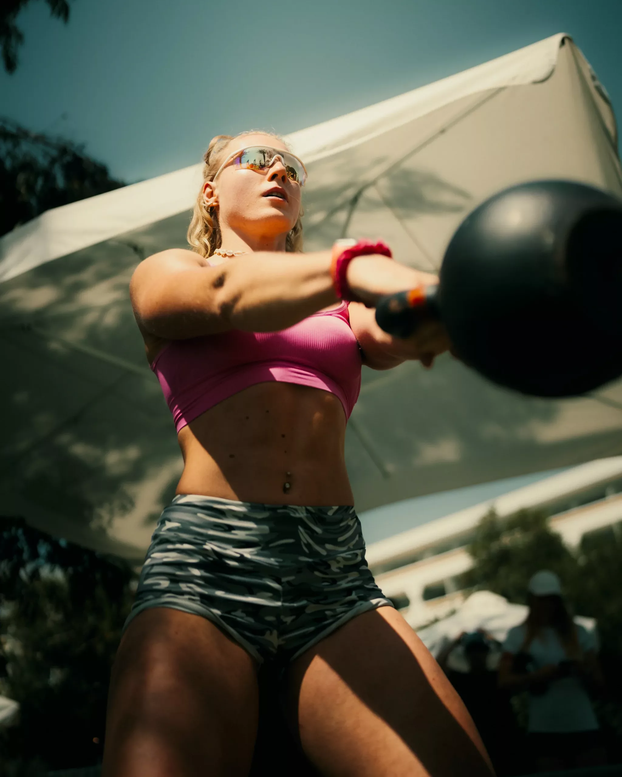 Delia lifting a kettlebell
